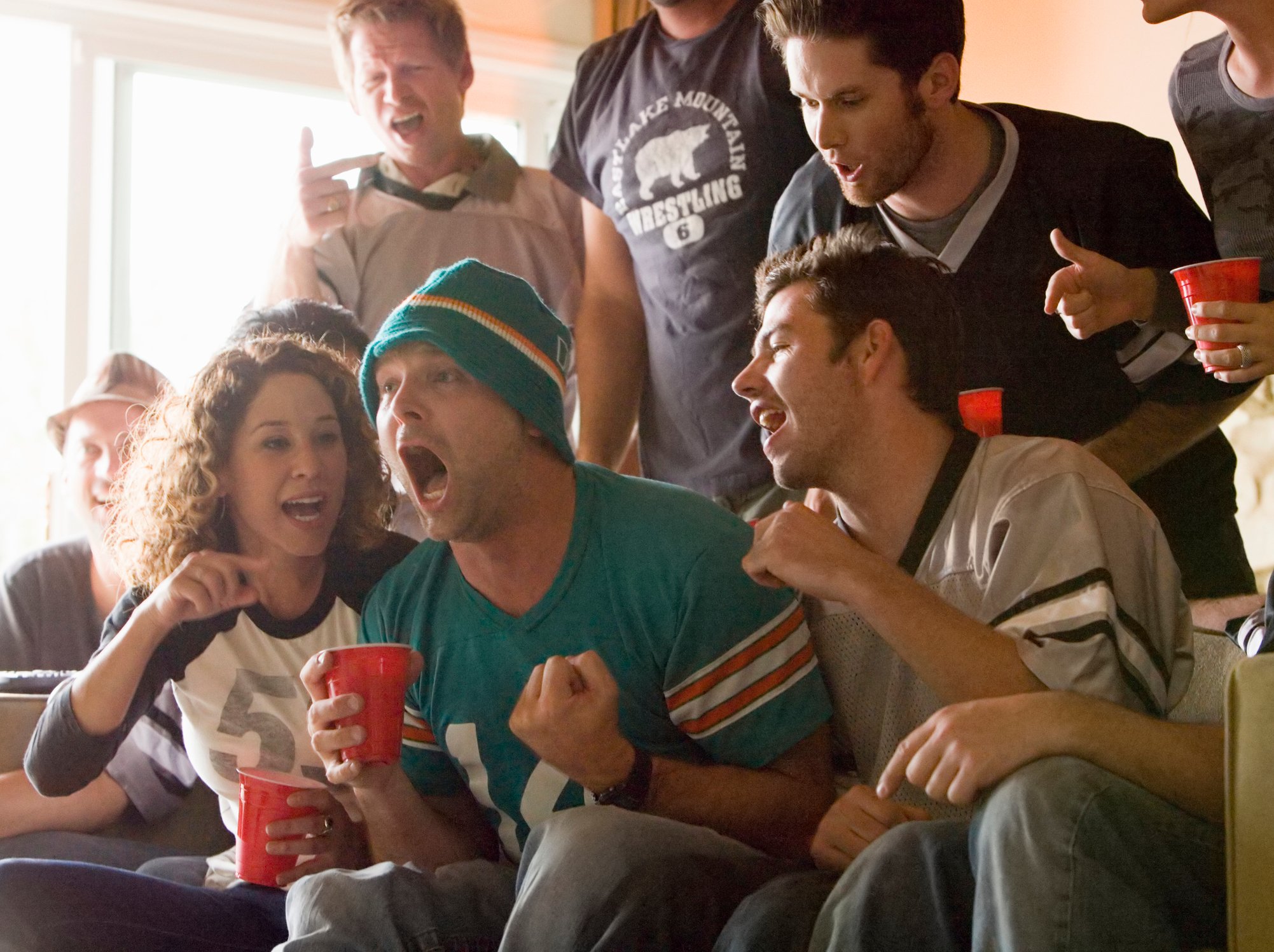 Friends watch football