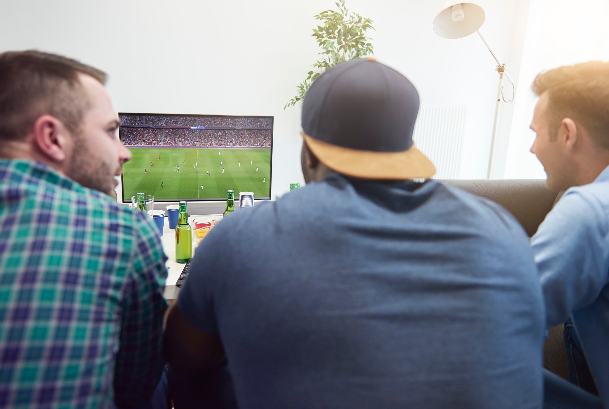 Friends watch a football game