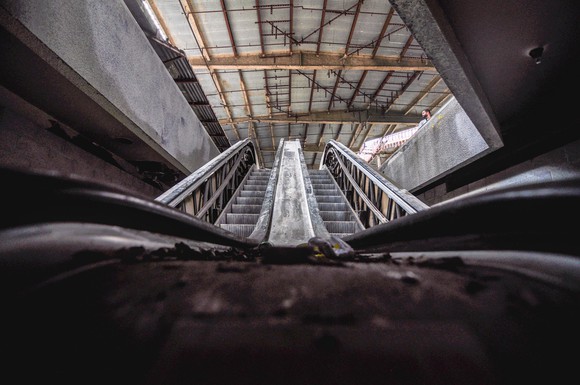 A view from the bottom on an escelator in an abandoned mall.