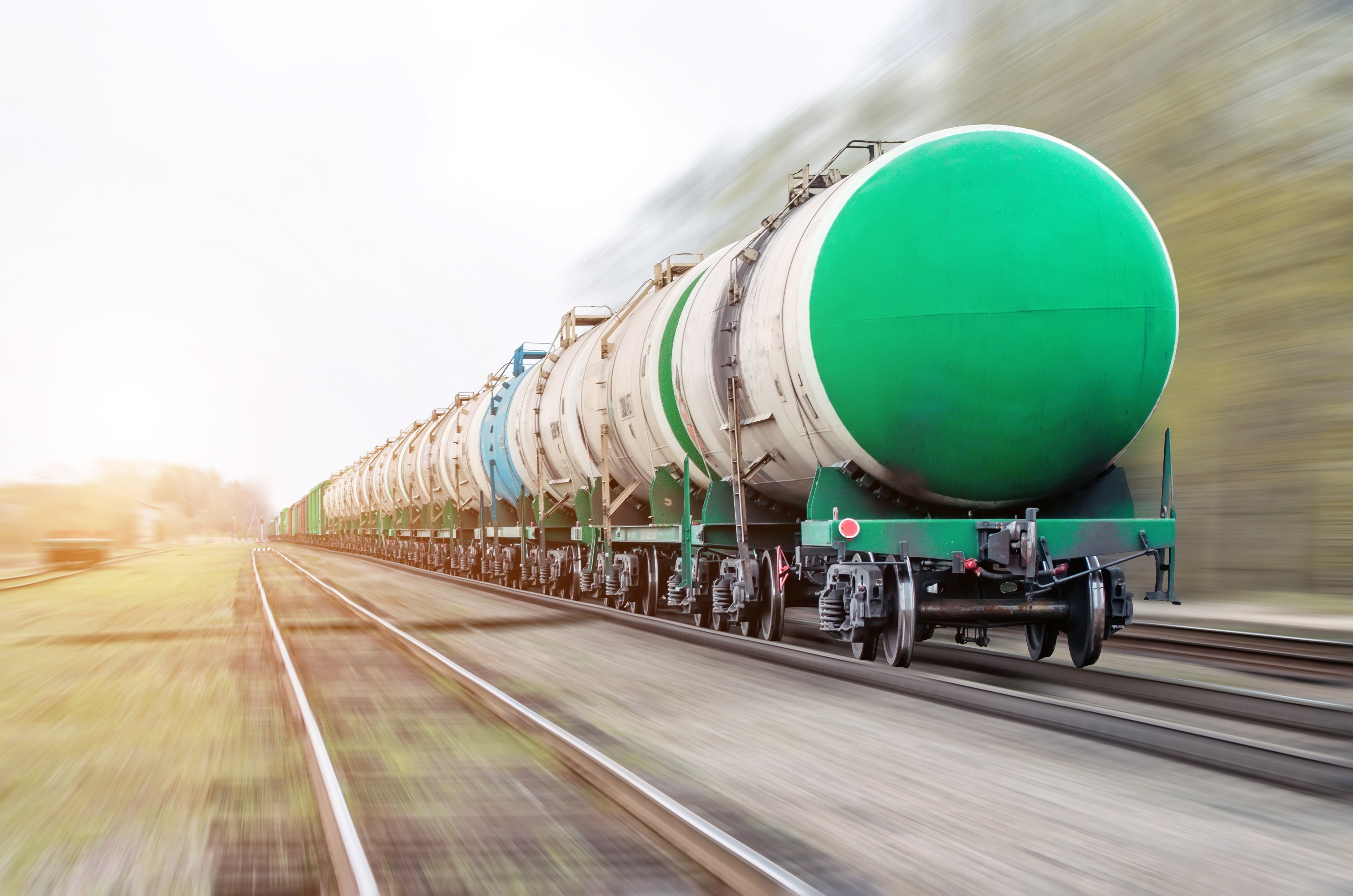 Oil cars on moving train.