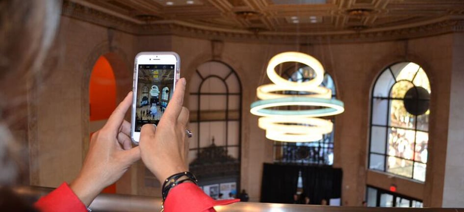 A woman takes a picture at AT&T's flagship store in San Francisco.