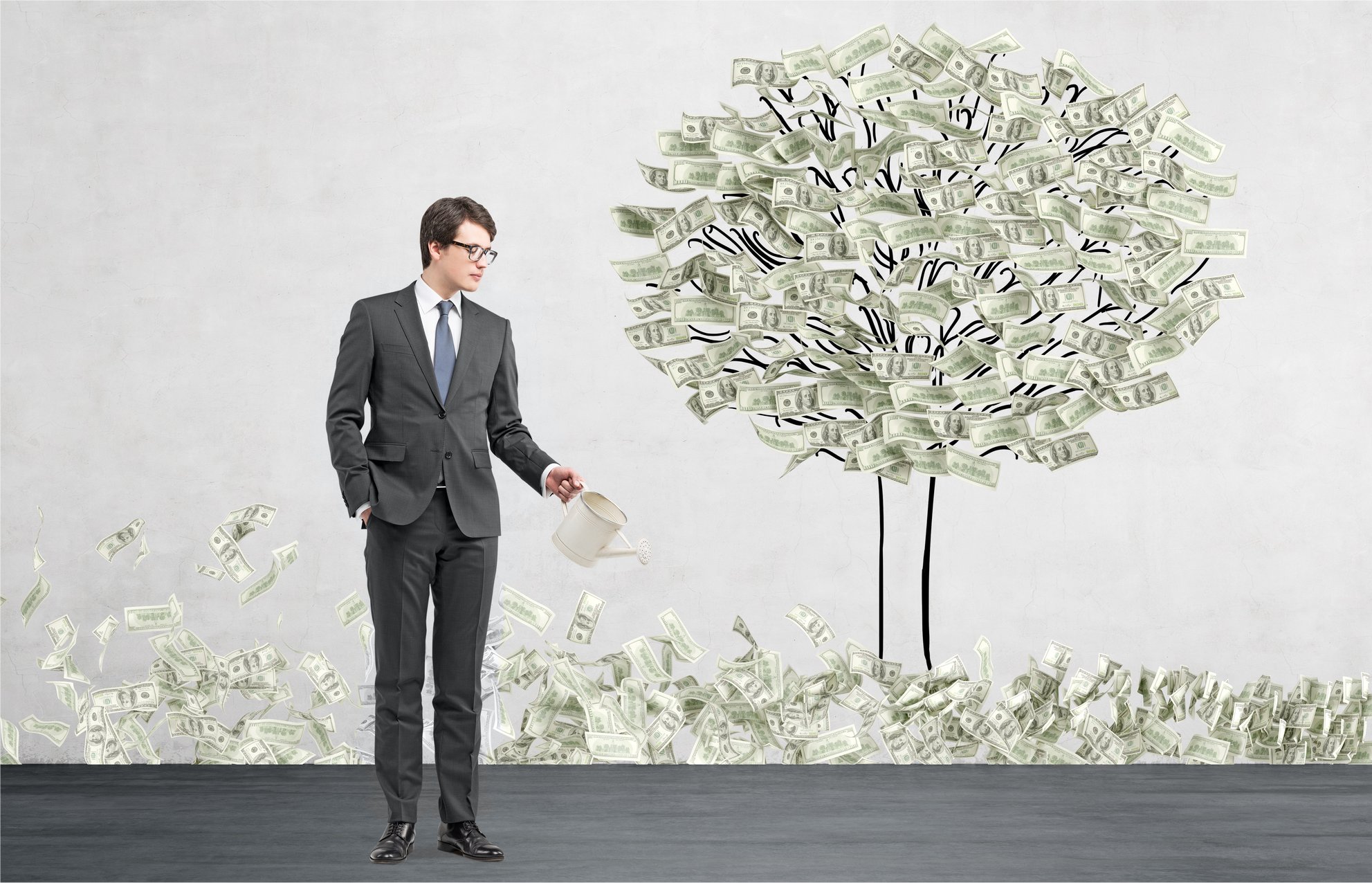 A man "growing" a money tree.
