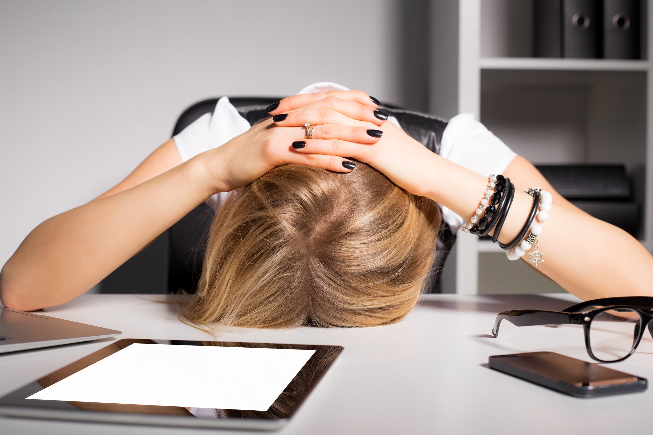 Frustrated woman at her desk