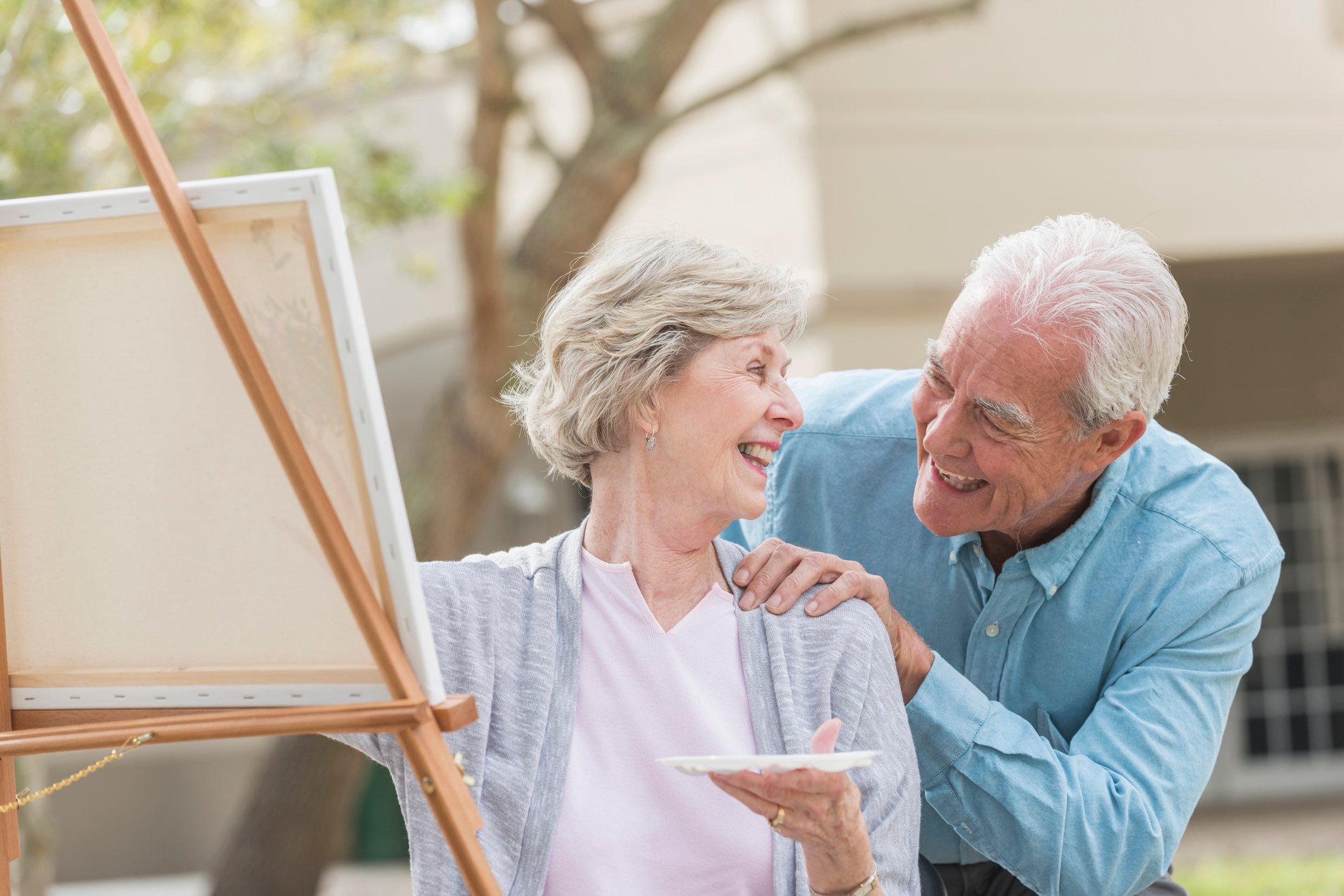 Retired couple working on a painting