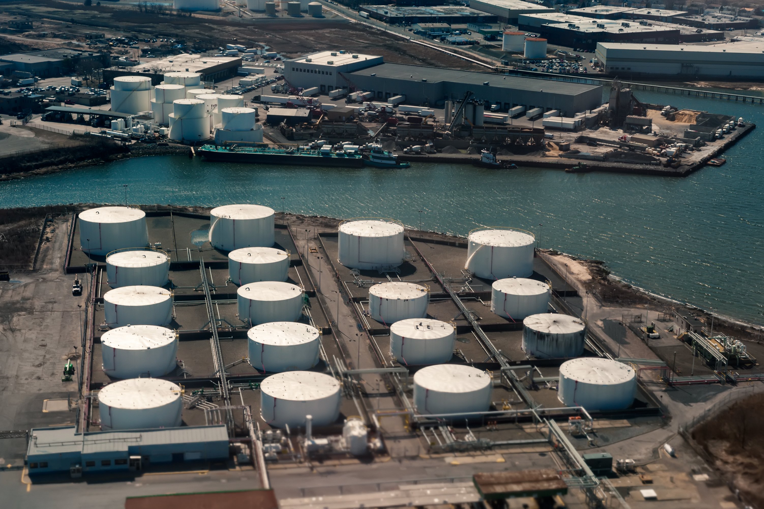 Aerial view of oil tanker and storage tanks.