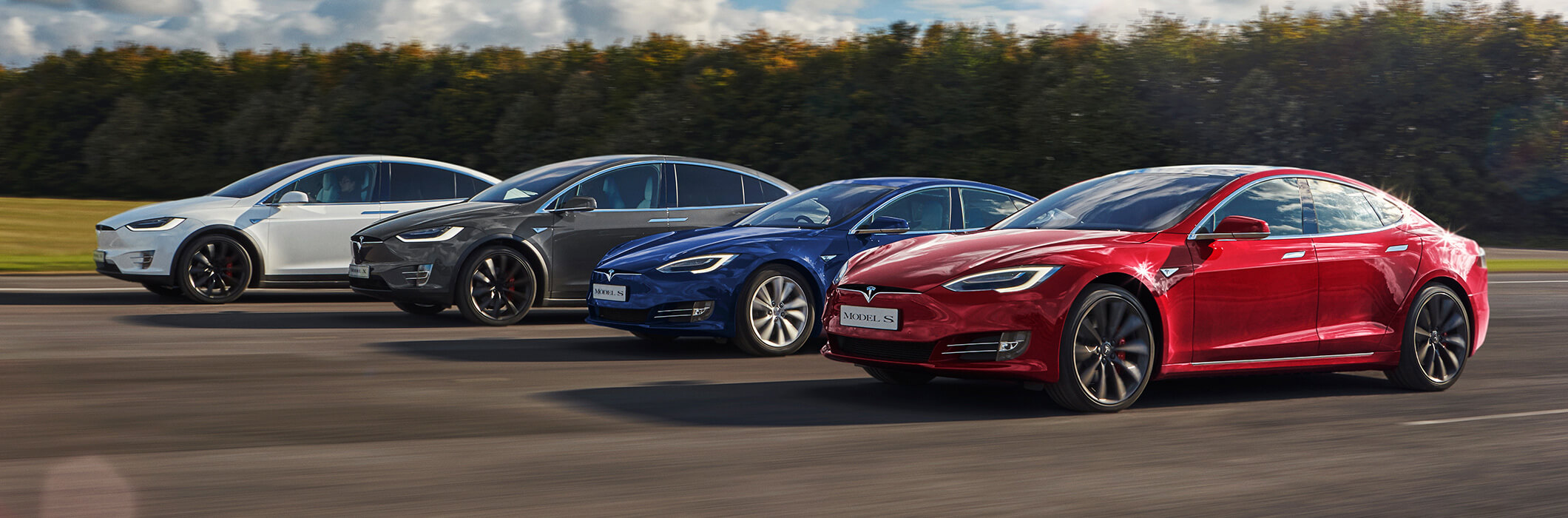 Tesla vehicles driving side-by-side