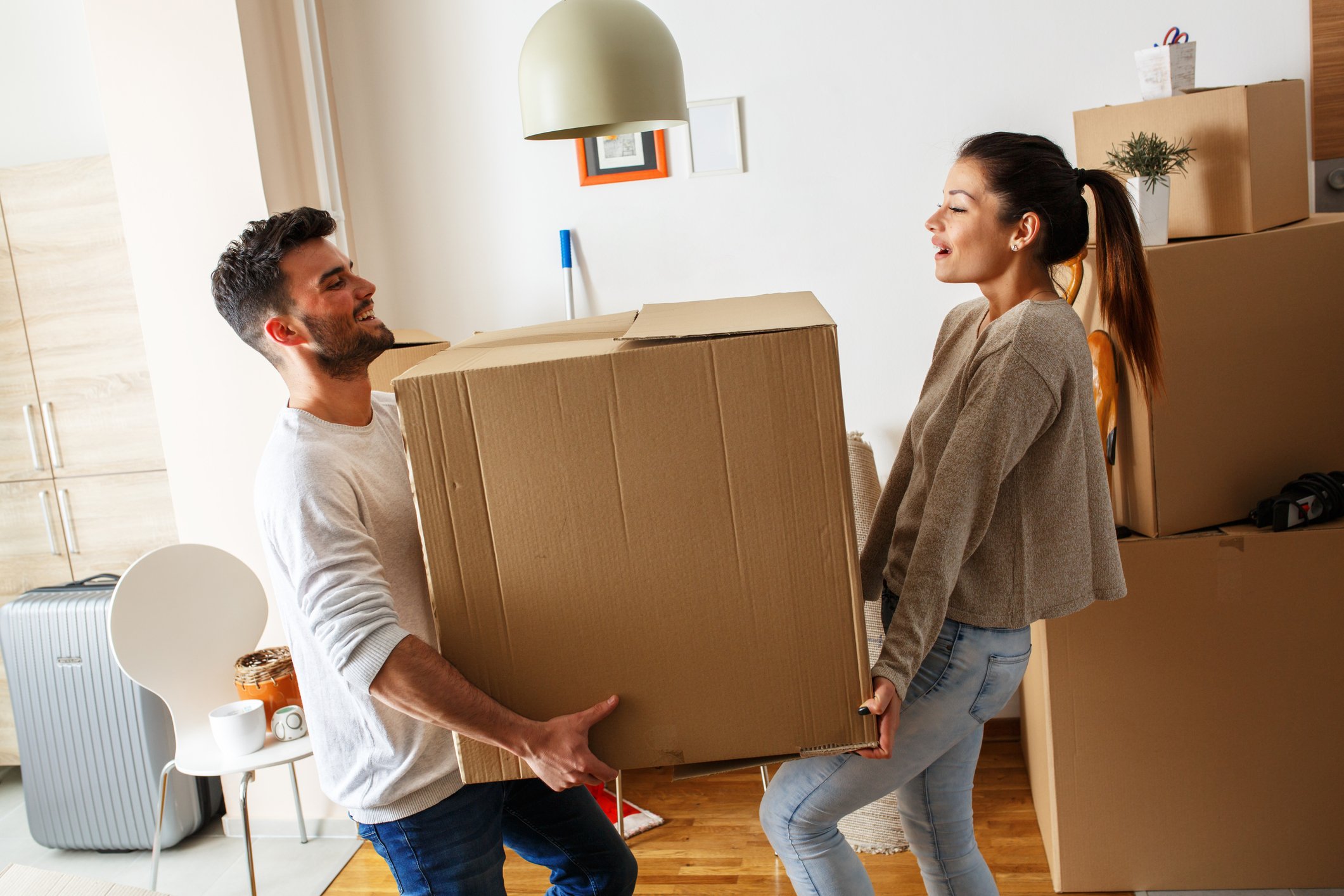 Couple moving big box