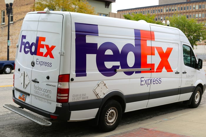 A FedEx Express delivery truck parked on the side of the road.