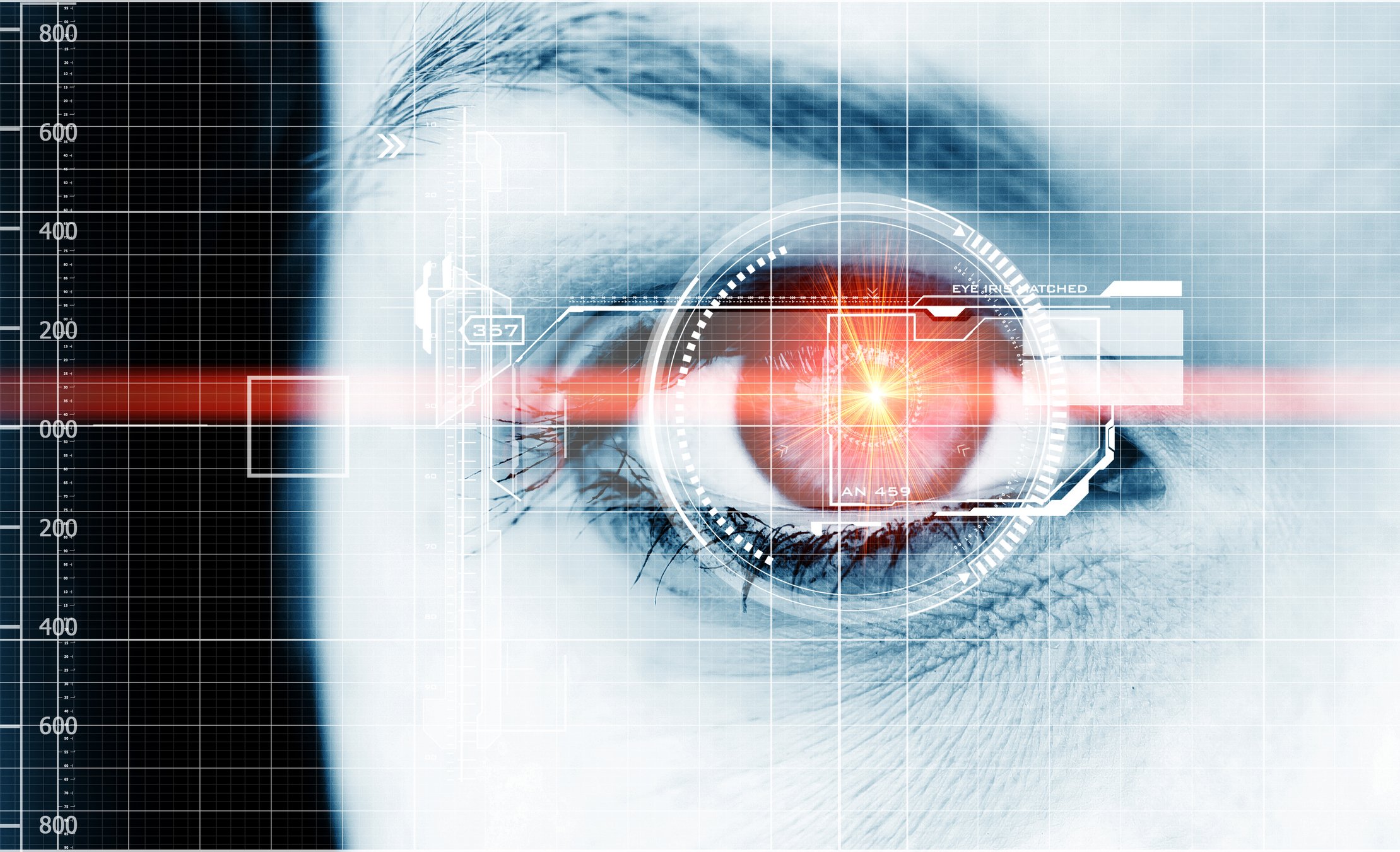 Woman's eye with technology images overlaid on it.