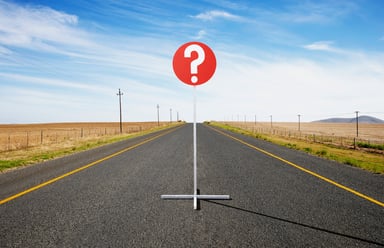 Question sign in road