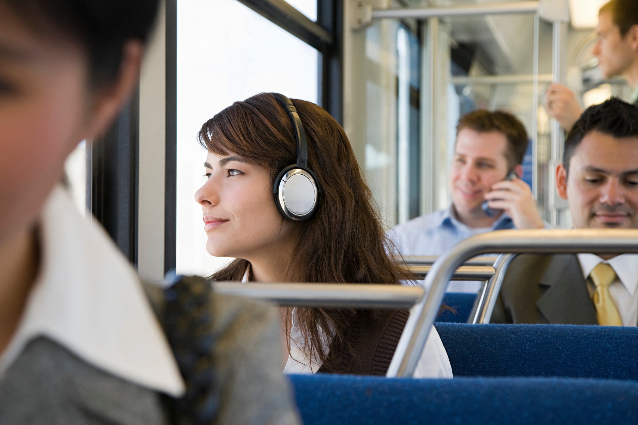 Woman with headphones, commuting