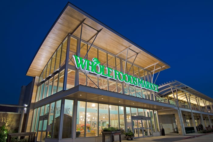 Whole Foods store entrance at night.