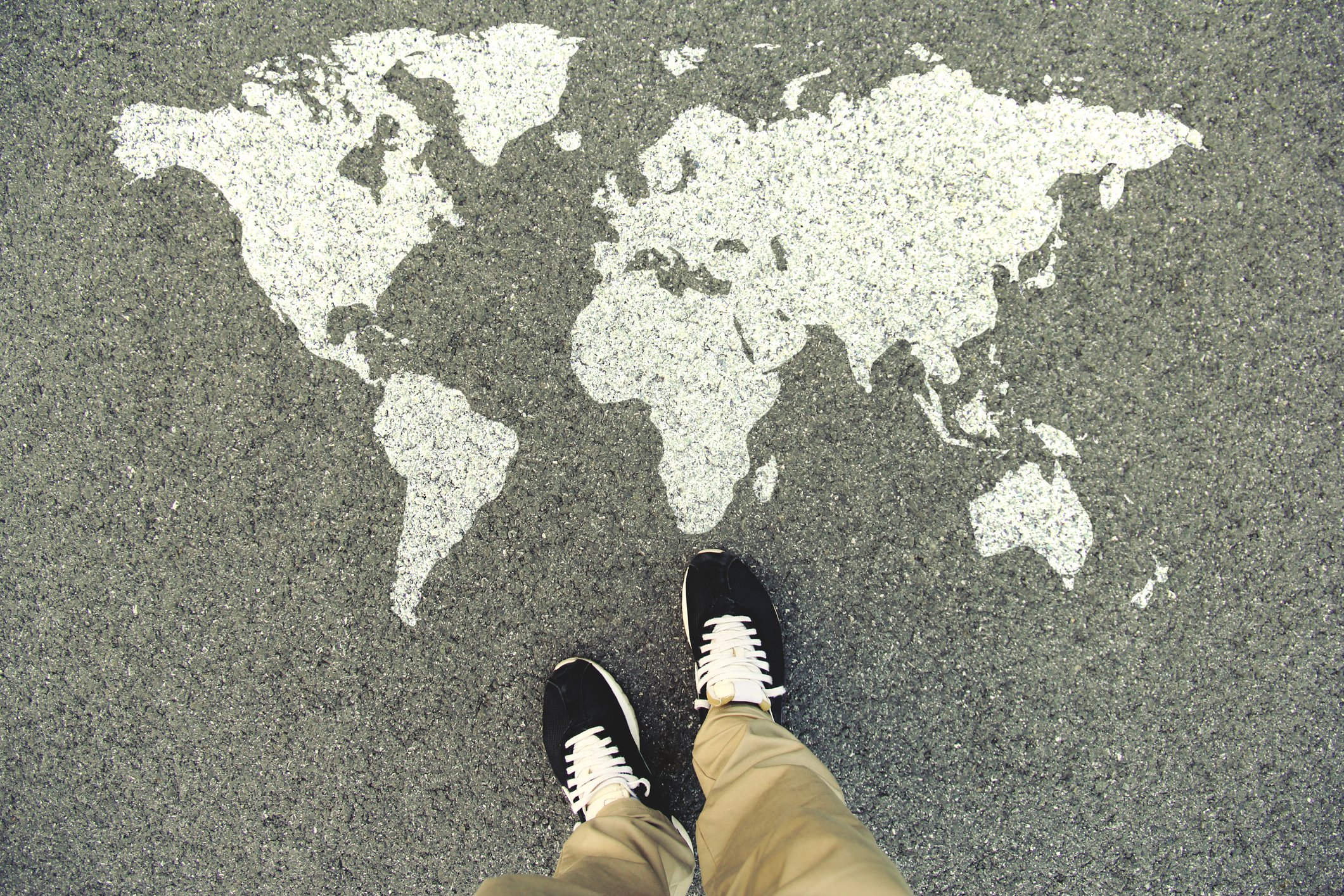 World map on asphalt.
