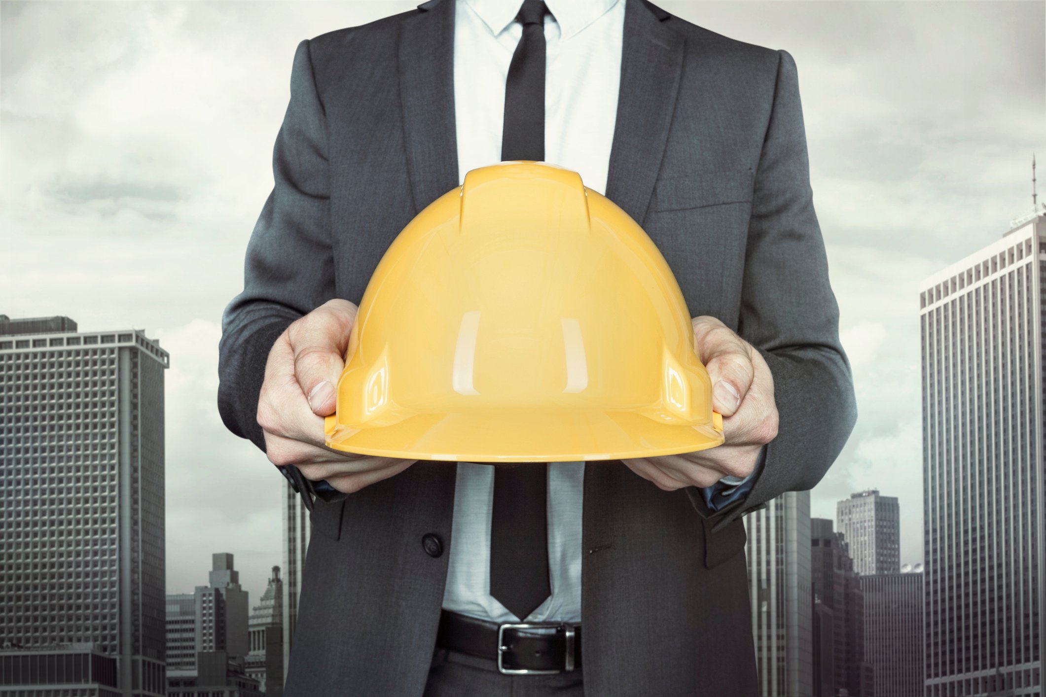 A man holding a hardhat.