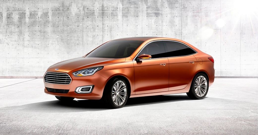 A brown Ford Escort sedan