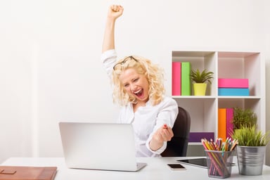 Happy woman in office