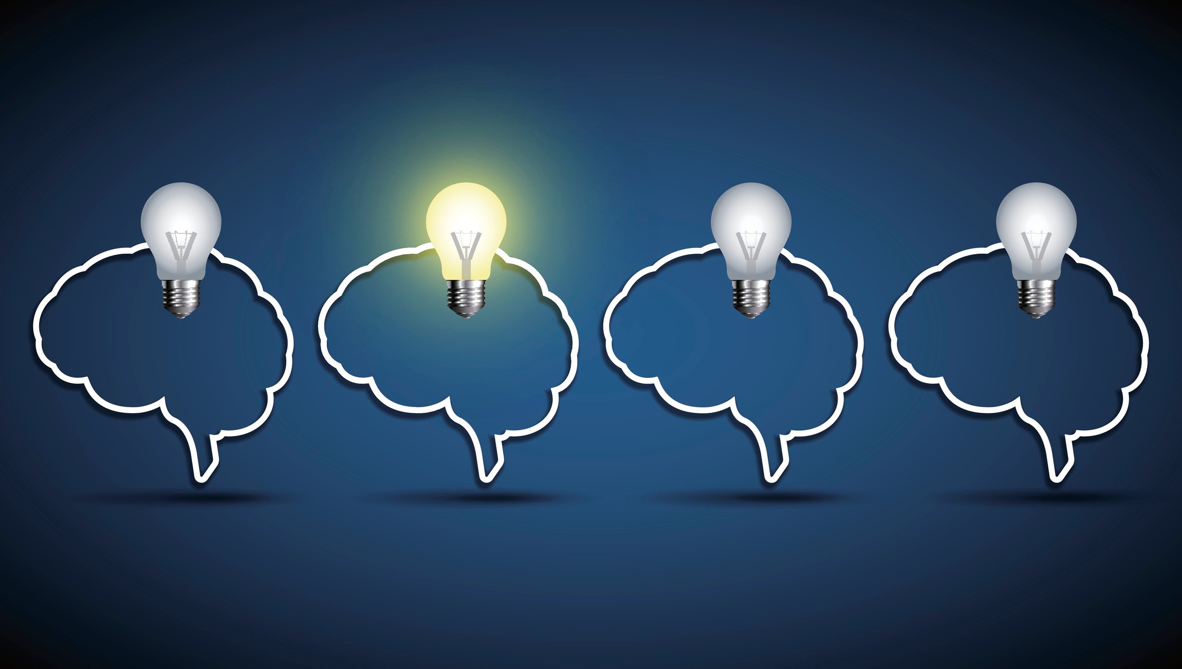 Outline of four human brains with light bulbs on top of each -- one is lit up.