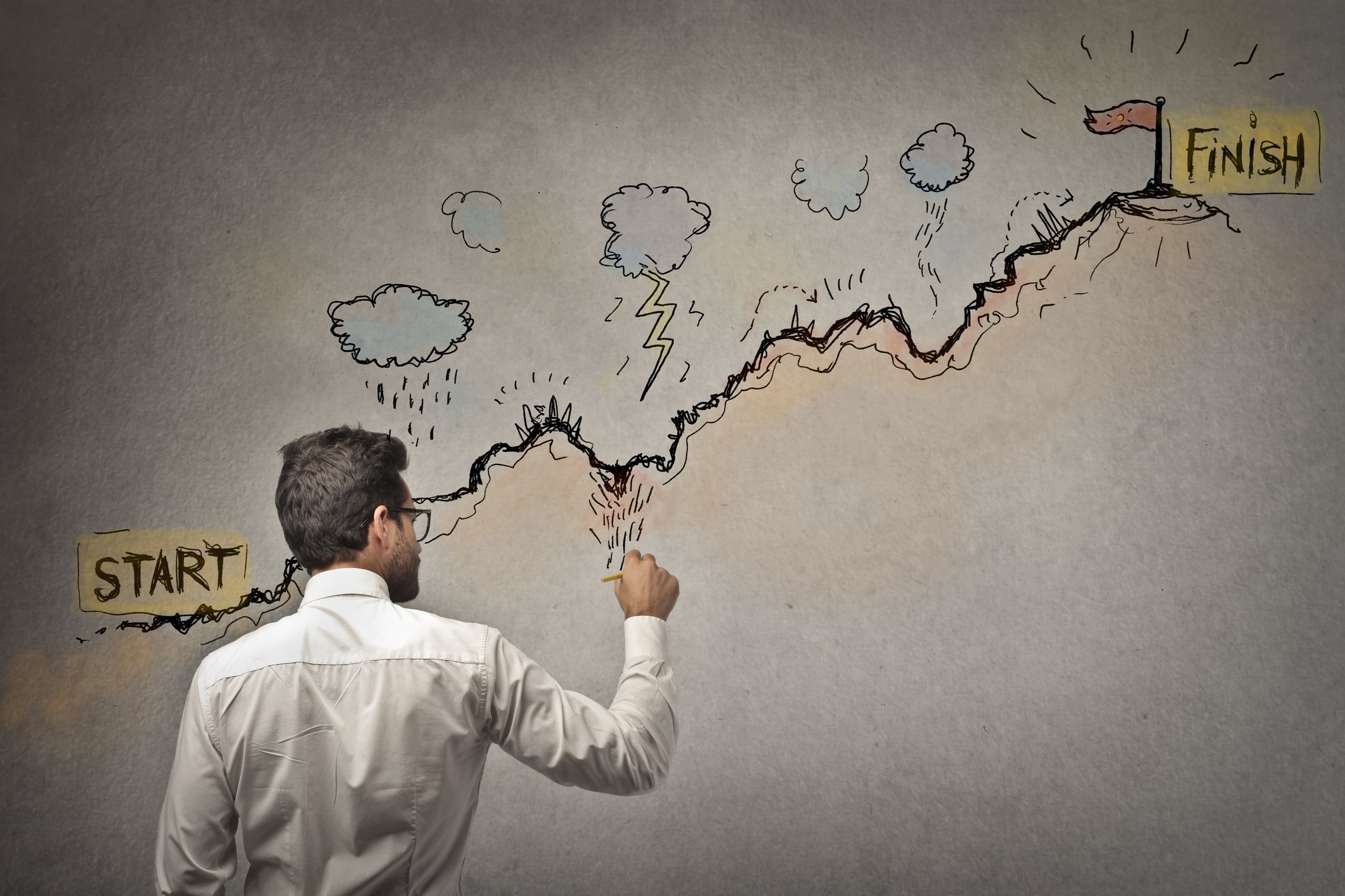 An investor traces a rising graph situated below storm clouds.