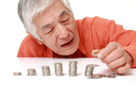 Stacks of coins falling over.