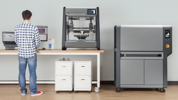 Desktop Metal's two 3D printers shown in an office.