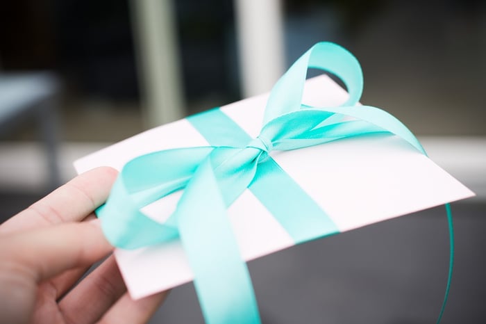 A gift card in an envelope with a ribbon