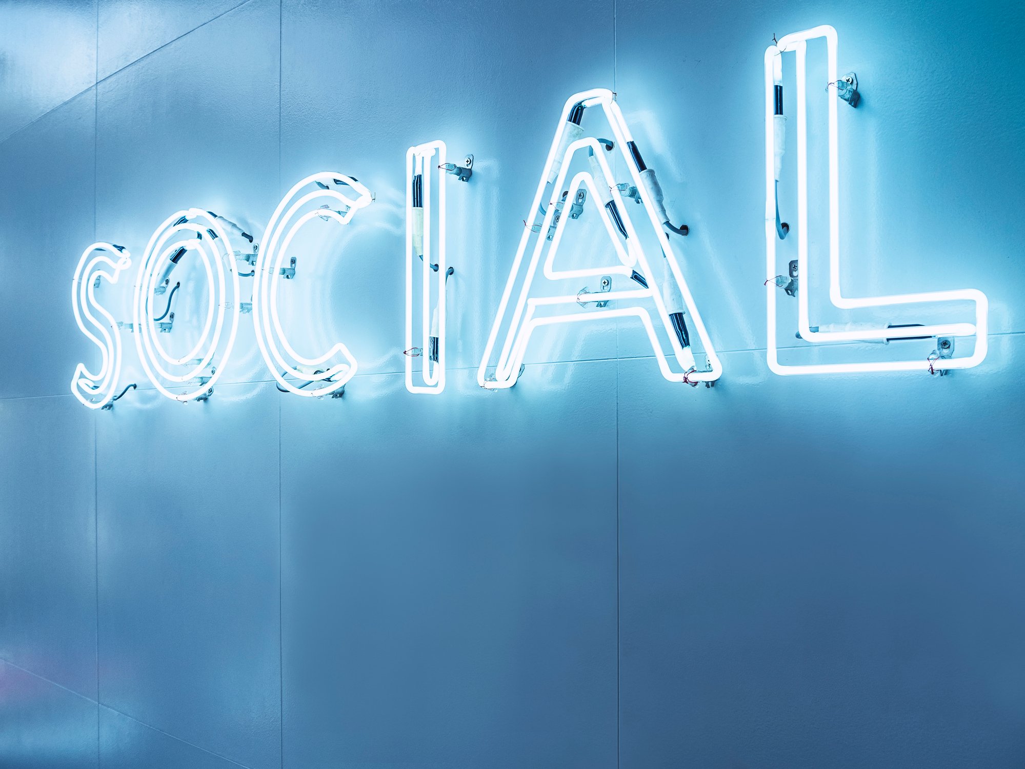 A neon sign reading "social"