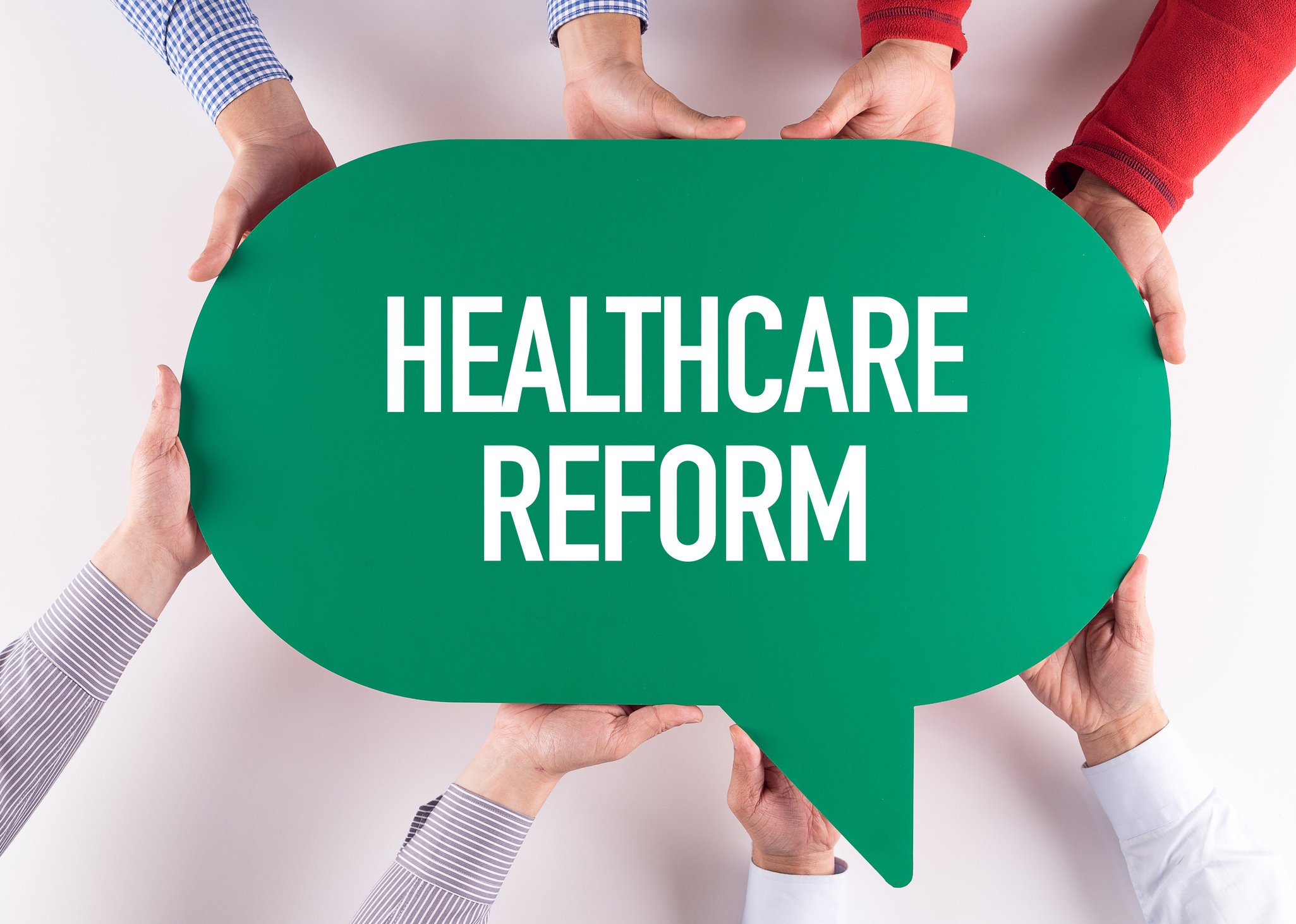 Hands holding caption stating "Healthcare Reform"