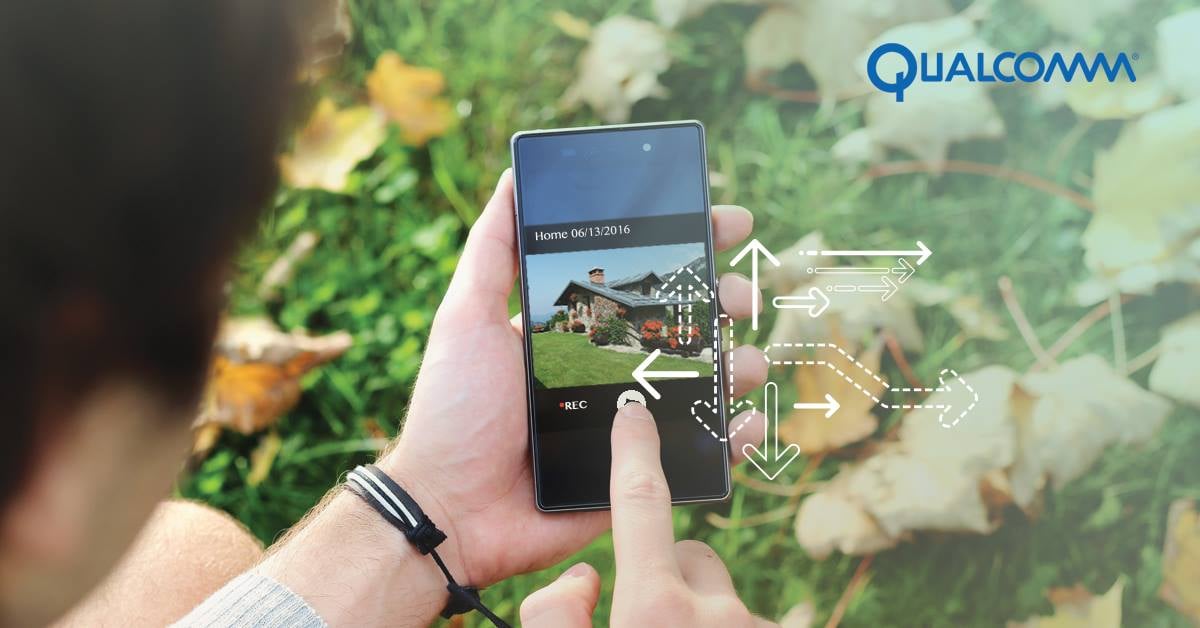 A man using a smartphone to control his home