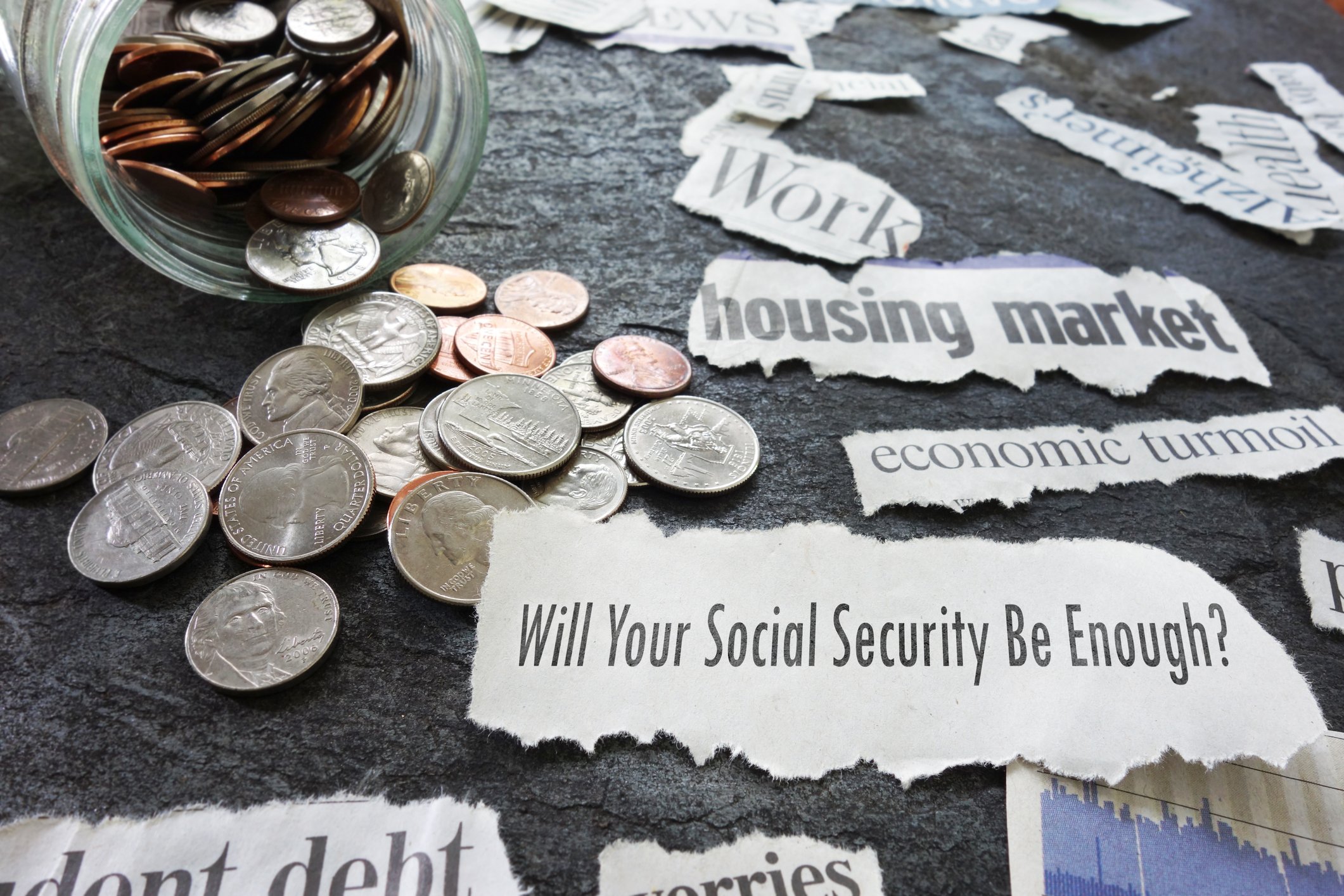 A change jar surrounded by Social Security headlines.
