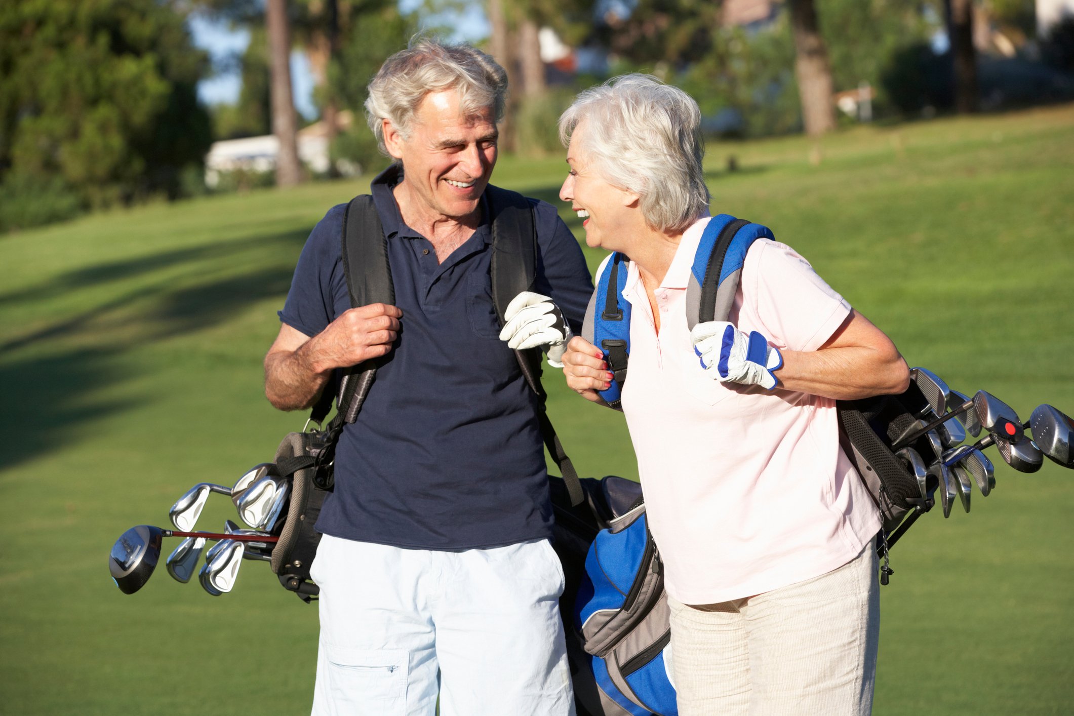 Retired couple playing golf