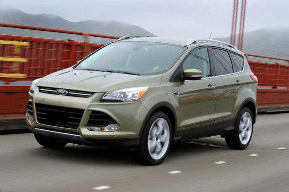 2013 Ford Escape driving on a bridge.