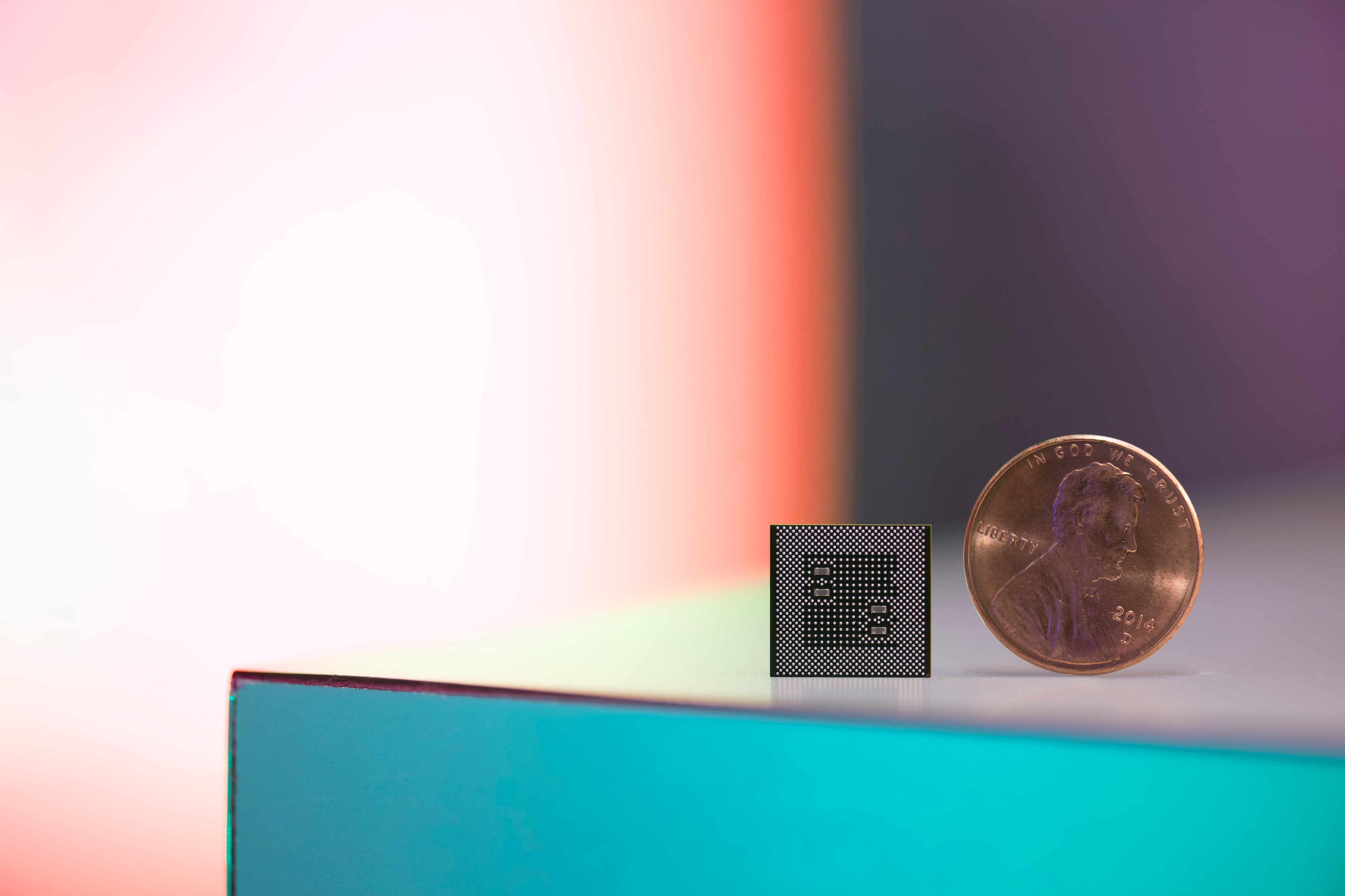 A Snapdragon 835 chip compared to a penny.