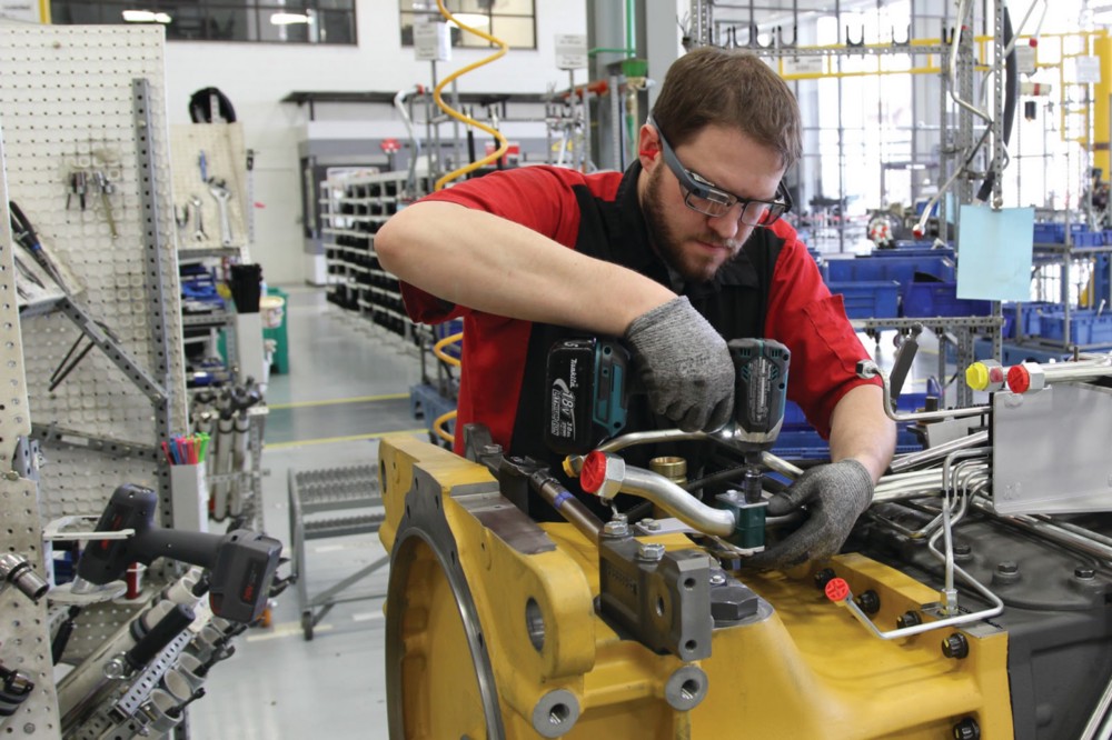 Man working in factory wearing Google Glass.
