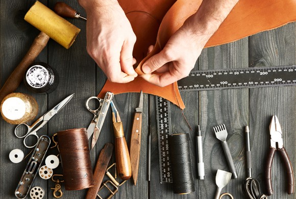 Craftsman working on a leather product