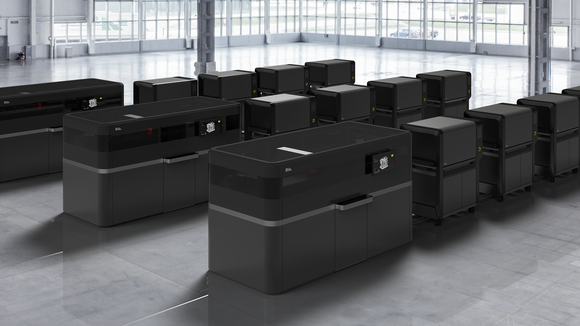 several units of DM Production System in a large room.