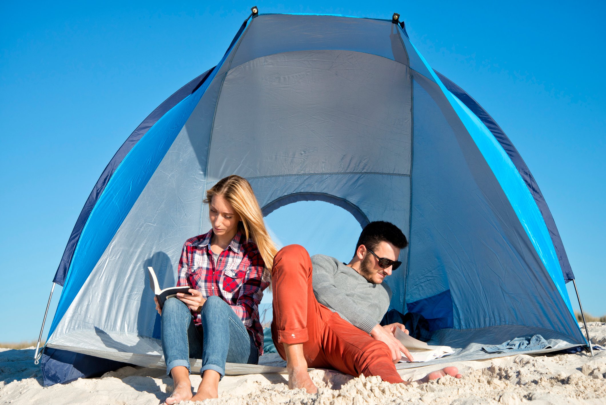 Couple reading at the beach.