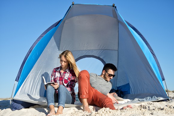 Couple reading at the beach.