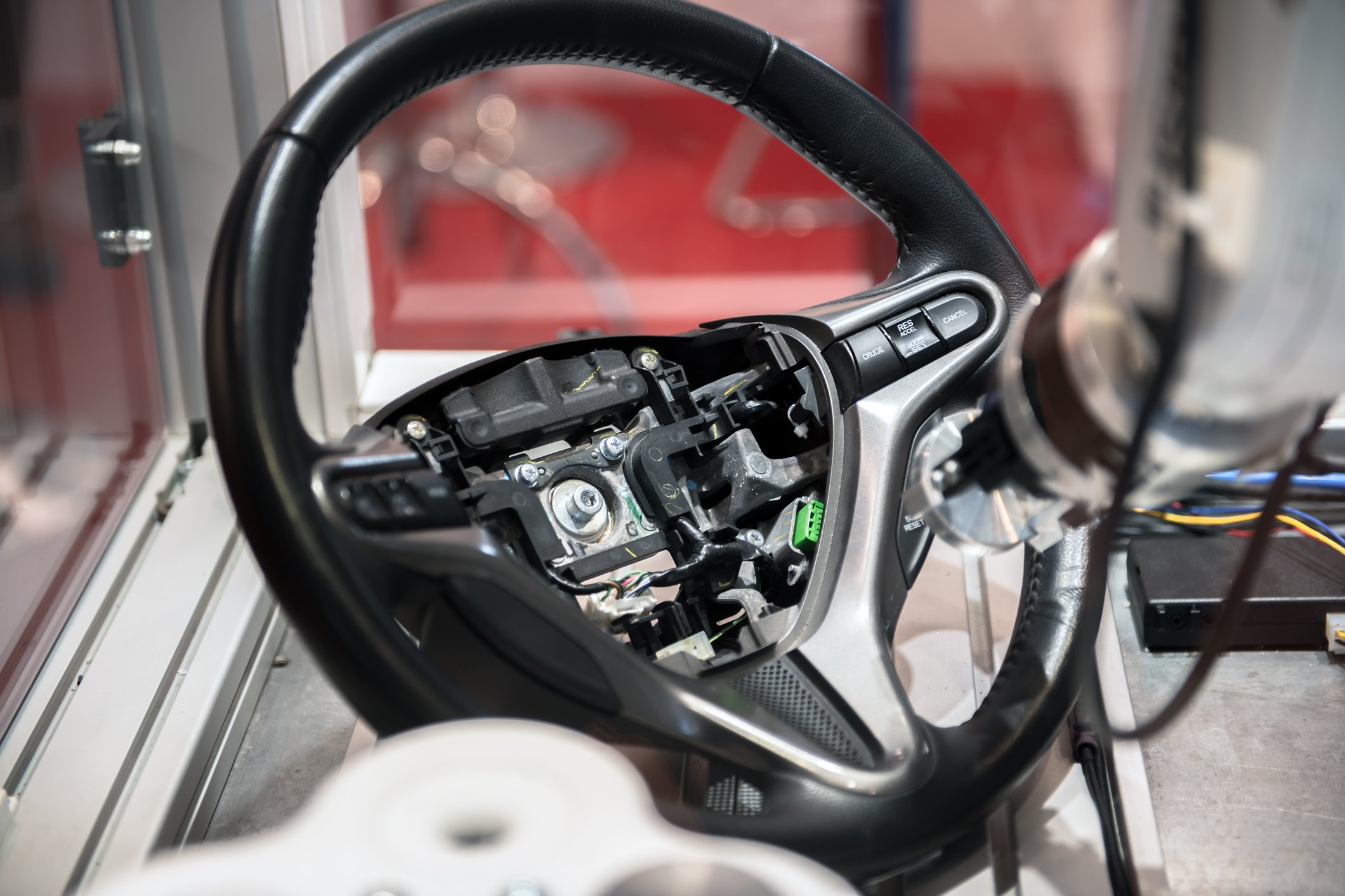 A robotic arm building a car steering wheel.