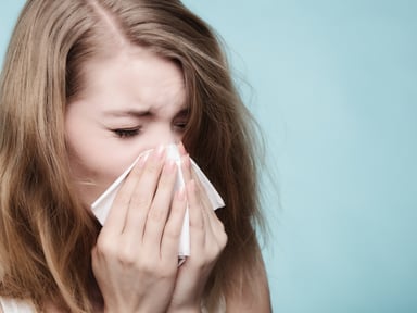 woman sneezing_GettyImages-538144183