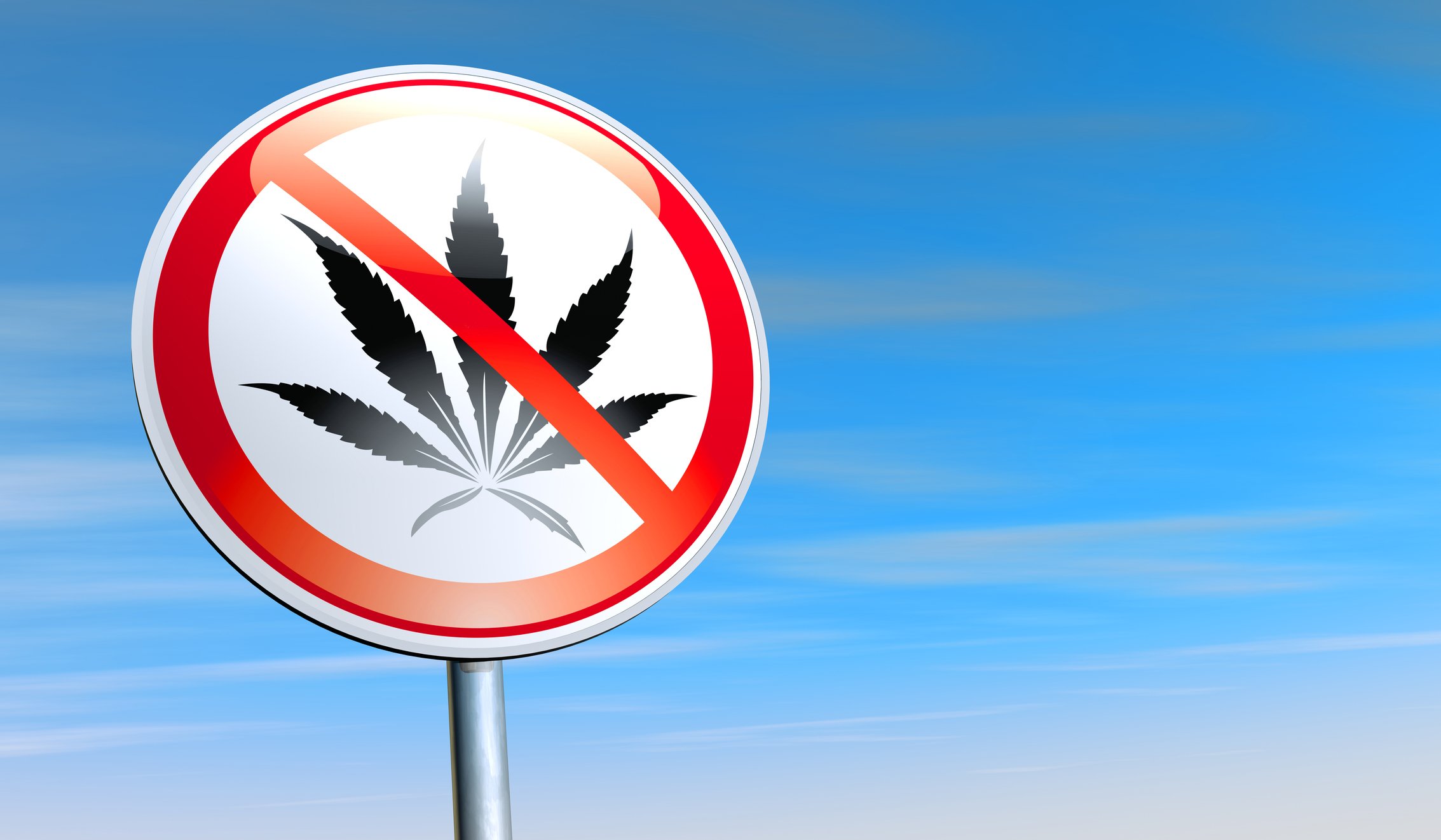 A sign with a marijuana leaf has a cross through it.