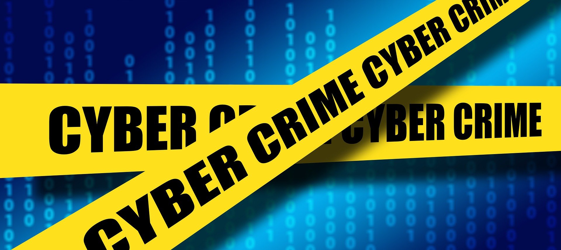 Cyber Crime yellow tape over blue digits background.