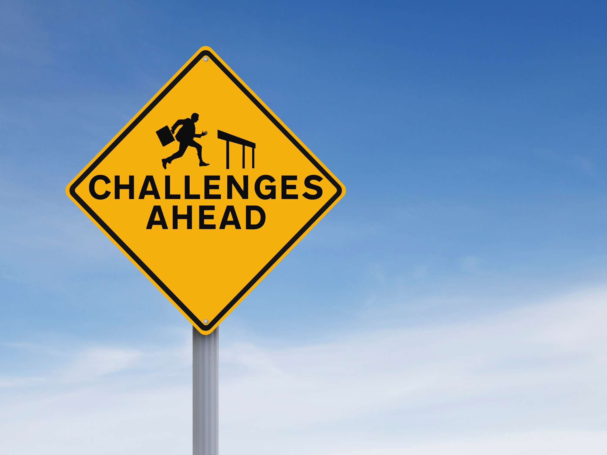 A road sign saying "Challenges Ahead"