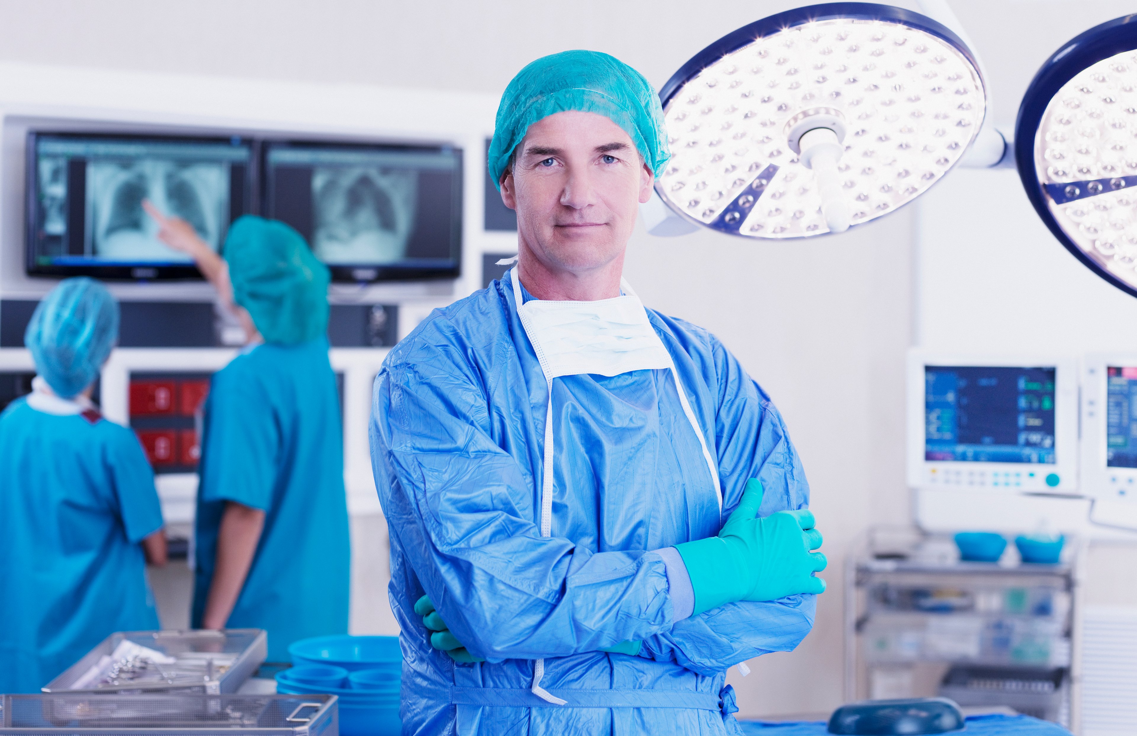 A surgeon standing in an operating room