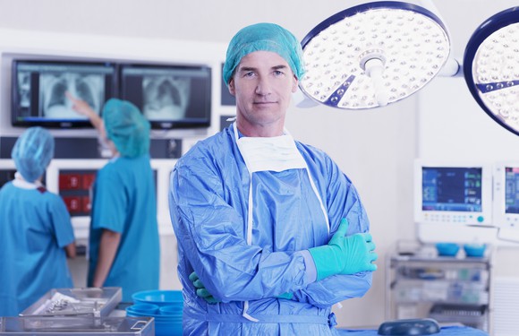 A surgeon standing in an operating room
