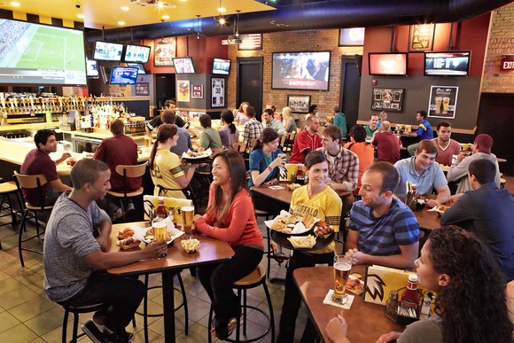 A B-Dubs location on game day, happy guests at every table.