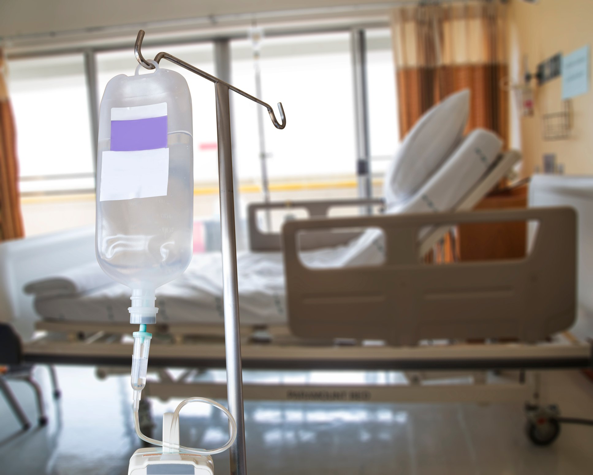 IV bag next to a hospital bed