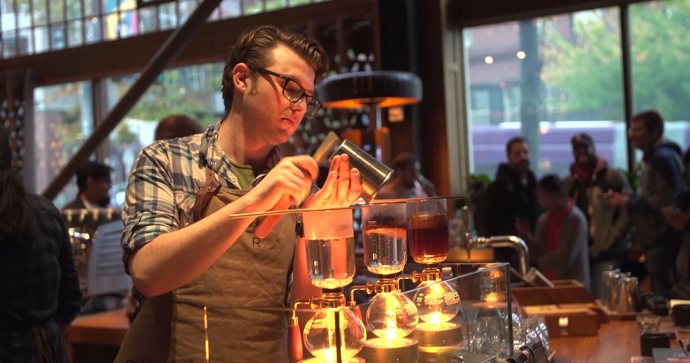 Starbucks employee making coffee. 