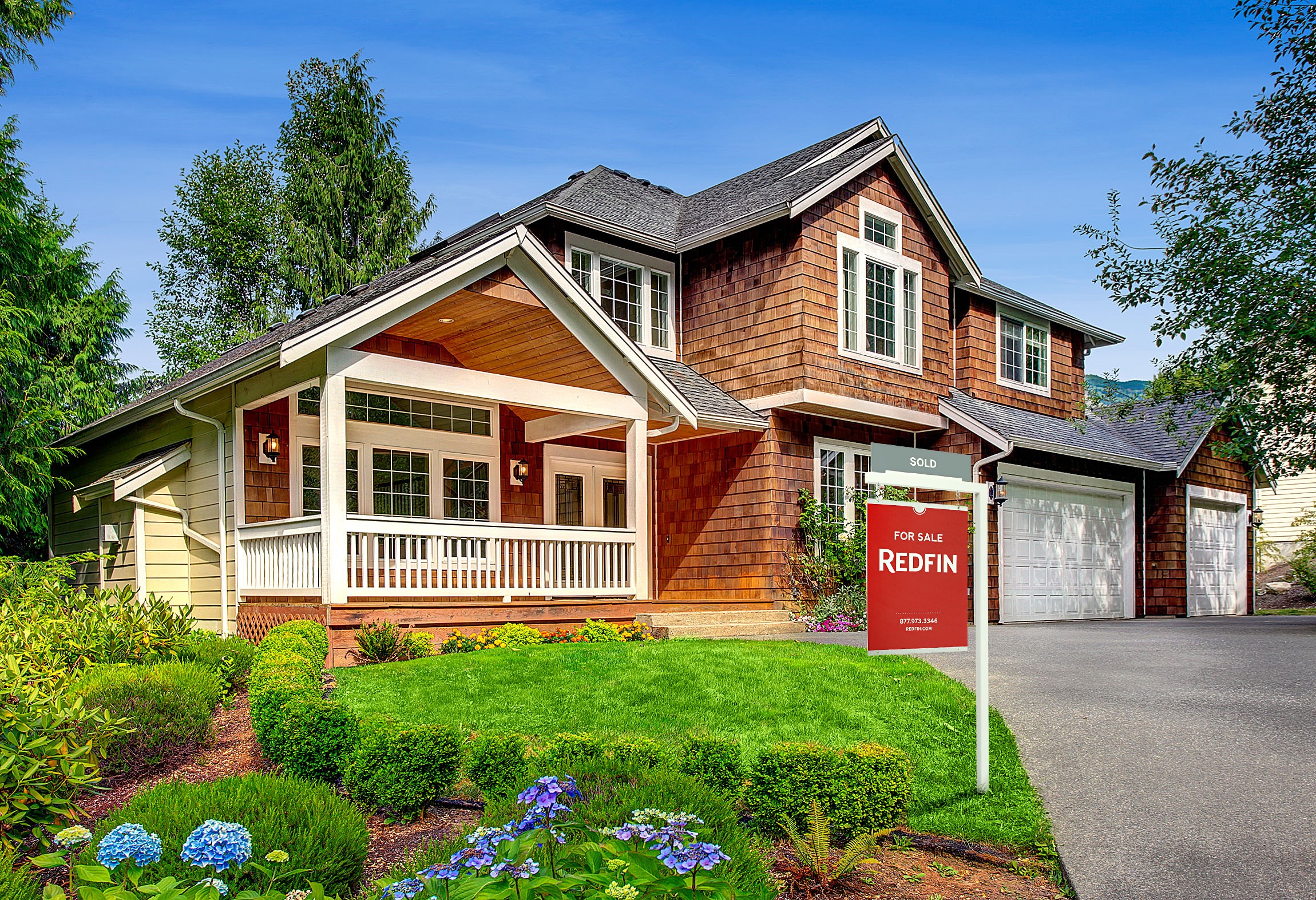 Redfin sale sign in front of a home.