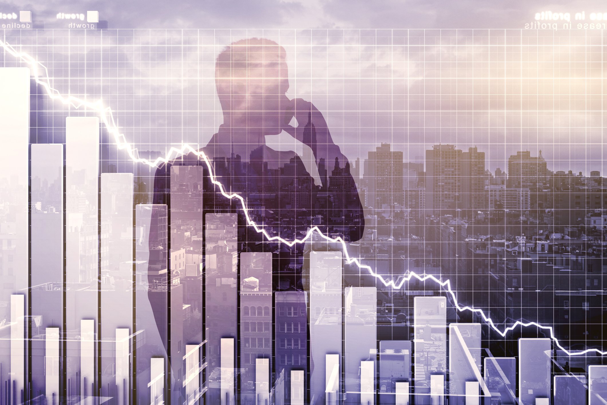 Man's silhouette imposed on declining stock chart
