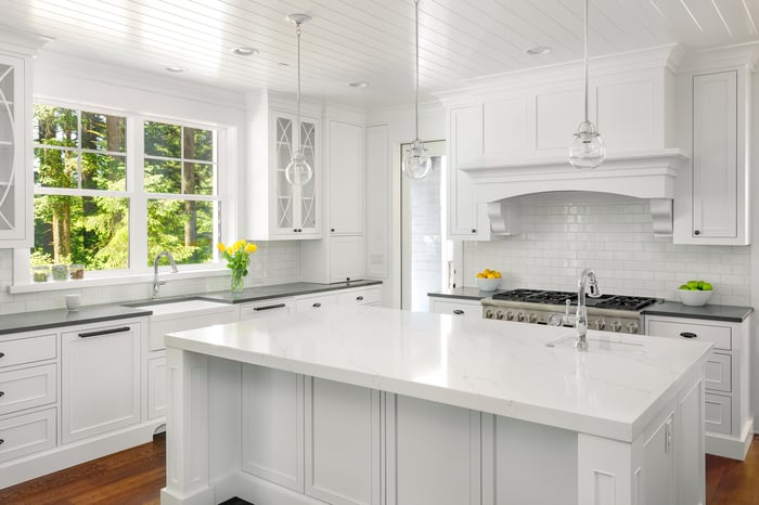 Kitchen with both white and grey countertops. 